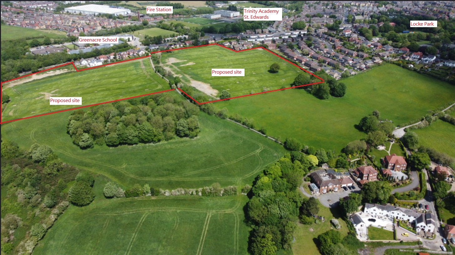 Aerial photograph looking across Kingstone, with the Green Belt site outlined in red. Greenacre School, the fire station, Trinity Academy St Edward's and Locke Park are labelled around it, with open countryside and large houses to the south.